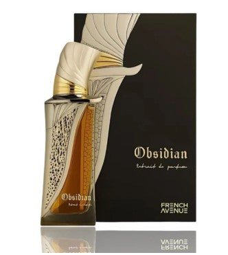 Perfume bottle in angled view with metallic cap, silver patterned label, and amber liquid.