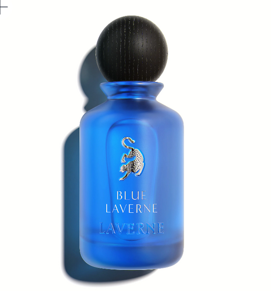 Blue eau de parfum bottle with dark spherical cap, blue glass, gold logo, front label