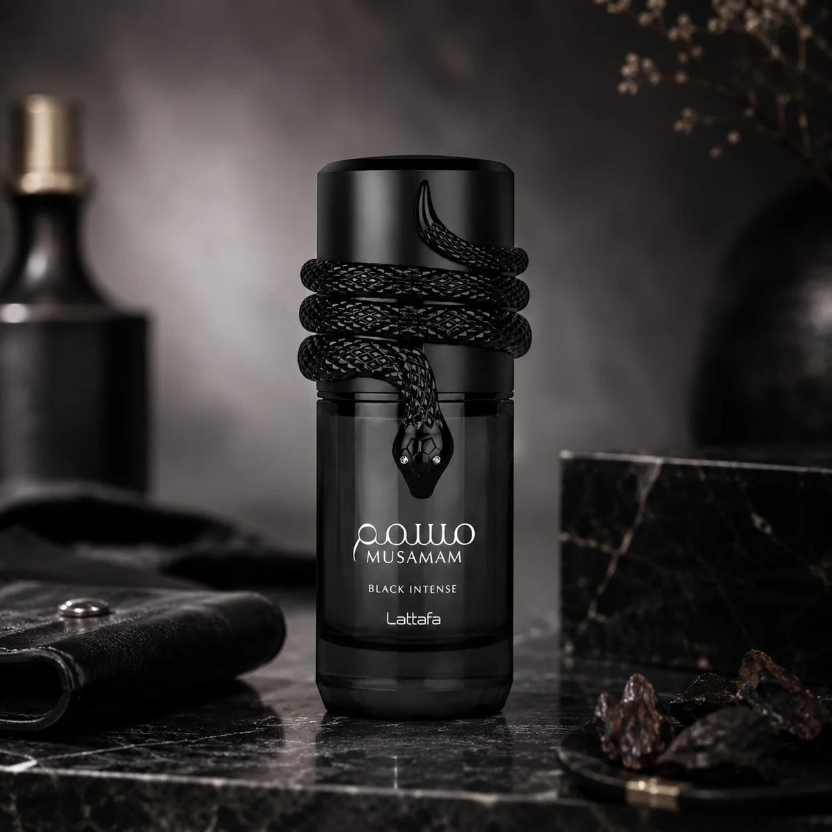 Black EDP perfume bottle on countertop, coiled rope neck detail and Lattafa label