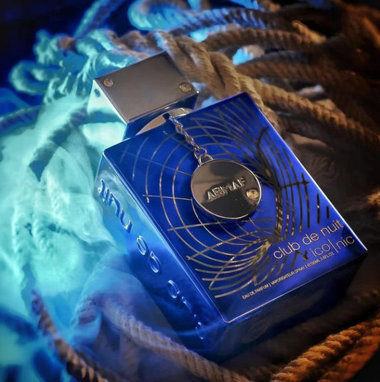 Blue eau de parfum bottle close-up with metal cap and circular brand medallion