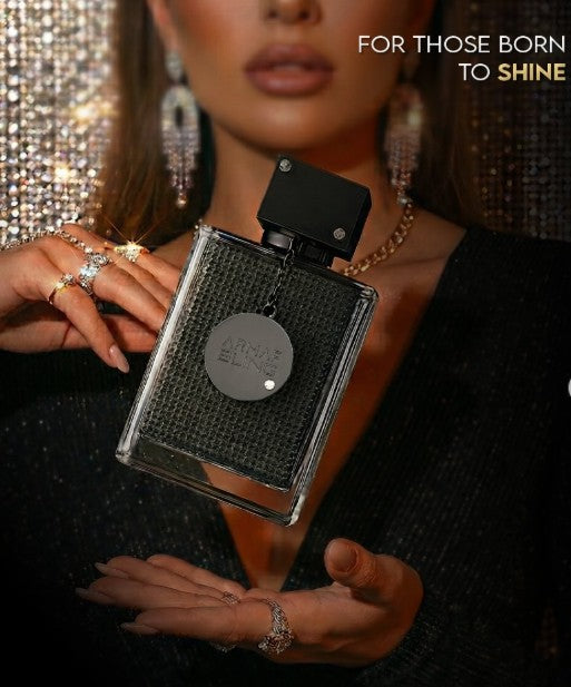 Eau de parfum bottle with black cap and textured silver glitter finish