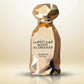 Gold faceted perfume bottle with dark cap, label marked MAHD AL DHAHAB