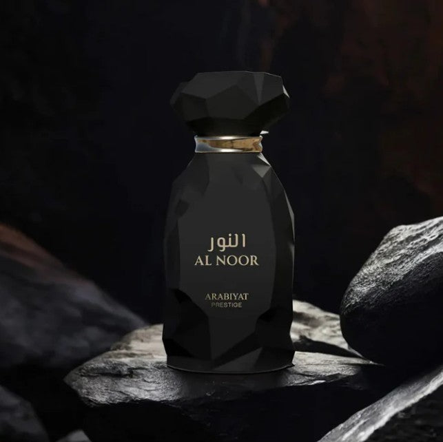Arabiyat Prestige Al Noor eau de parfum bottle, black faceted glass with gold cap