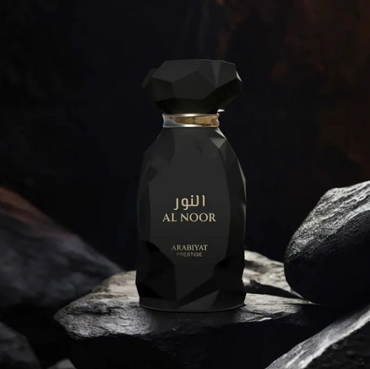 Arabiyat Prestige Al Noor eau de parfum bottle, black faceted glass with gold cap