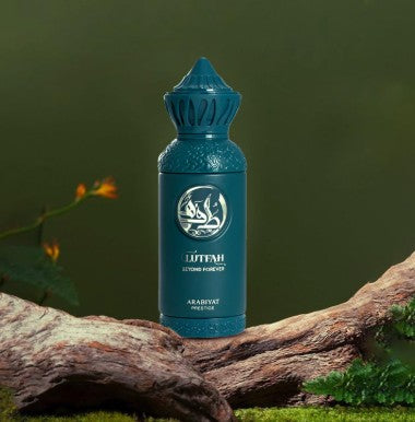 Teal glass fragrance bottle with raised emblem and faceted crown cap