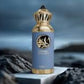 Blue eau de parfum bottle with gold ornate cap, standing on dark surface