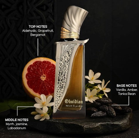 Perfume bottle with metallic cap, amber liquid, with grapefruit, flowers, and spices.