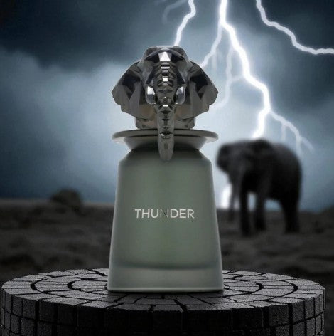 Thunder eau de parfum bottle with metallic lion head cap, frosted green glass