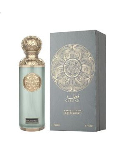 Glass eau de parfum bottle with blue liquid and ornate gold cap, shown with gray gift box