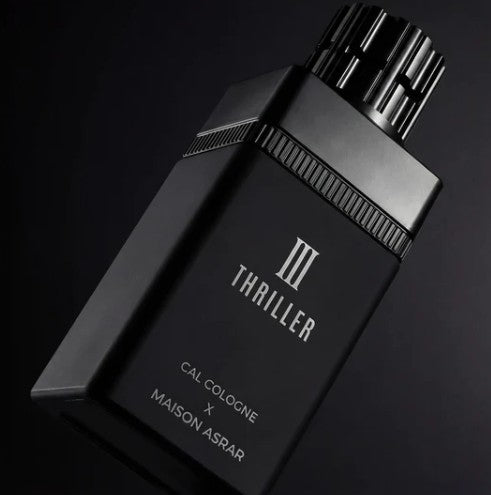 Cal Cologne perfume bottle angled view, black cap and body with 'III THRILLER' text
