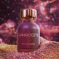 Maroon perfume bottle with gold cap, APHRODITE MYKONOS on textured base