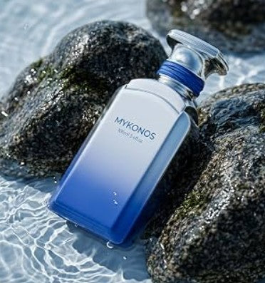 Blue extrait de parfum spray bottle with MYKONOS label and silver cap