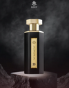 Reef 33 eau de parfum bottle with gold cap and label, on dark pedestal