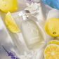 Mykonos extrait de parfum bottle, matte pale cream with leaf emblem and silver cap