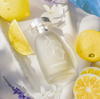 Mykonos extrait de parfum bottle, matte pale cream with leaf emblem and silver cap