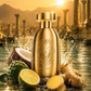 Gold perfume bottle with lion emblem with ginger and citrus around it