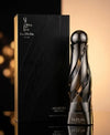 Men's eau de parfum bottle with black box, silver cap and reflective glass