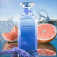 Blue glass perfume bottle with silver cap and MYKONOS label
