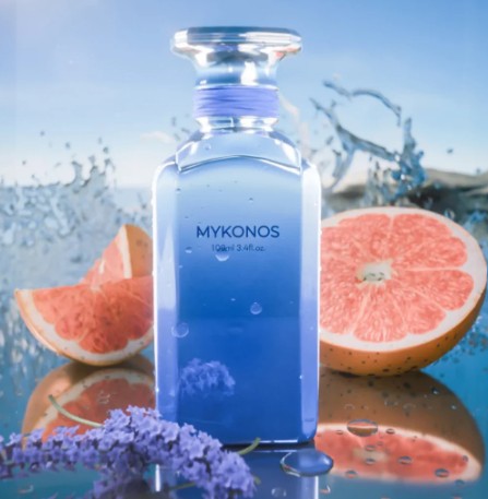 Blue glass perfume bottle with silver cap and MYKONOS label