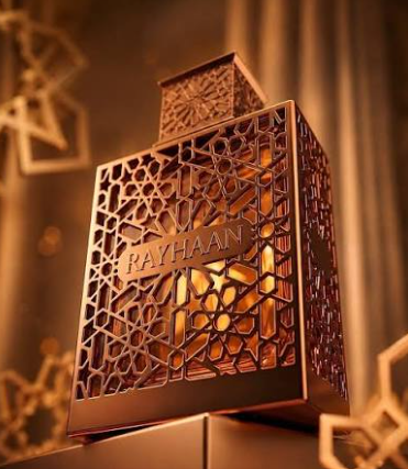 Rayhaan Vantage EDP bottle, amber geometric pattern with gold-tone frame, angled view