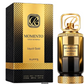 Perfume box and gold bottle set labeled “Momento Liquid Gold”